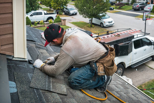 Professional Roofing technician working in Etna, NY